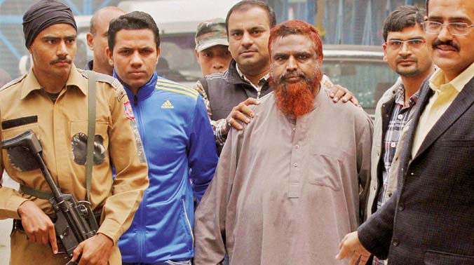 Madrasa teacher Maulana Anzar Shah, arrested by the Special Cell of Delhi police from Bengaluru, before he was produced in a court in New Delhi on Friday. Shah is suspected to have links with Al Qaeda's module in the Indian sub-continent (Photo: PTI) Madrasa teacher Maulana Anzar Shah, arrested by the Special Cell of Delhi police from Bengaluru, before he was produced in a court in New Delhi on Friday. Shah is suspected to have links with Al Qaeda's module in the Indian sub-continent (Photo: PTI)